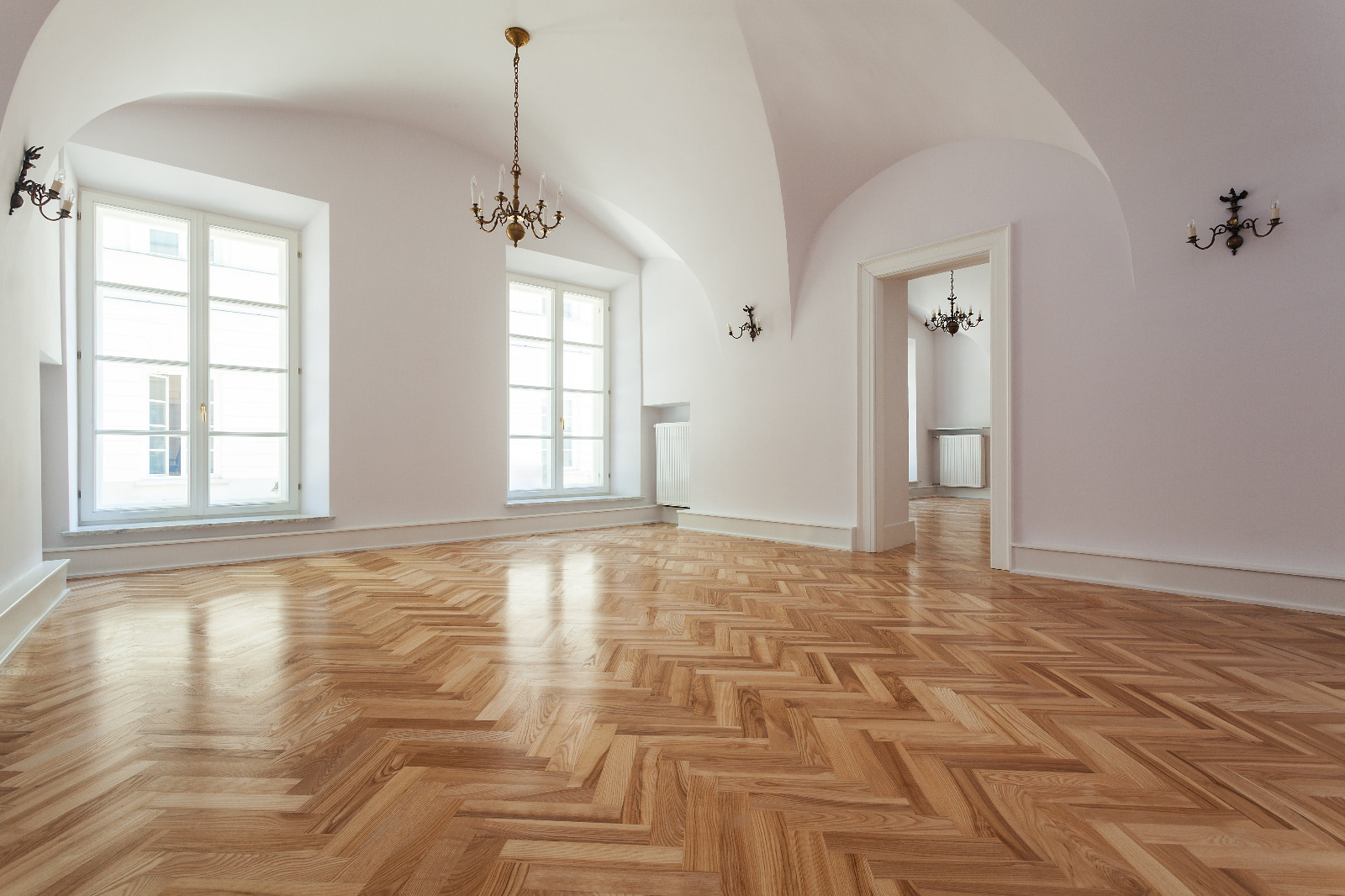 Wood Joyful Restoration in Lee: sunlit room with newly finished oak herringbone parquet (solid wood) floor in a warm satin sheen.